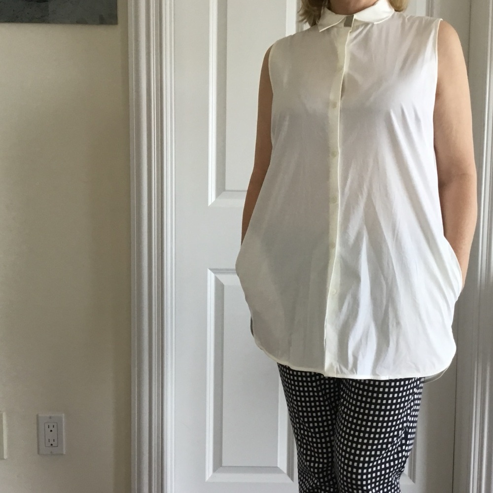 White Sleeveless Button-Up Long Top with side pockets.